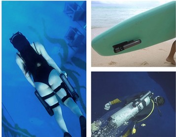 Waydoo Subnado underwater scooter junto a tabla de surf en aguas cristalinas