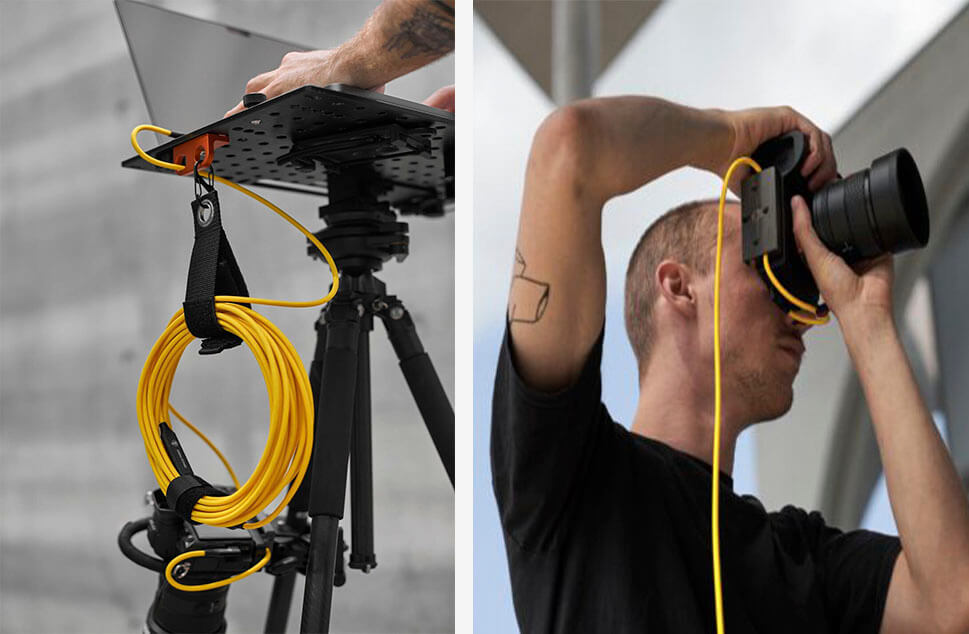 Fotógrafo usando cables de tethering para fotografía con CobraTether Fotógrafo utilizando cables de tethering para fotografía profesional con CobraTether